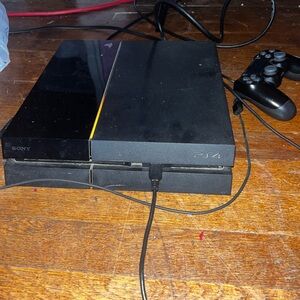 PS4 for sale with two working controllers.